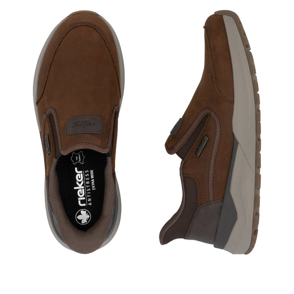 Brown slip-on shoes on a white background