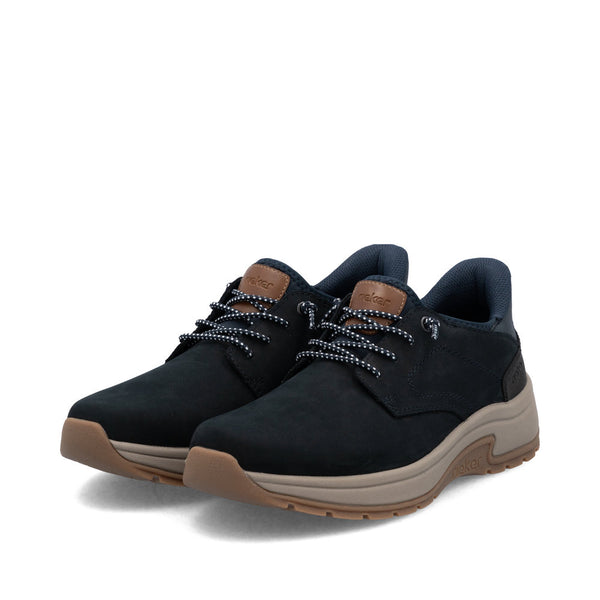 Pair of navy blue sneakers with brown soles on a white background