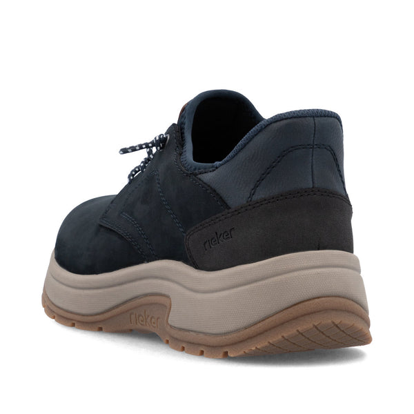 Bnavy blue and brown shoe with rieker branding on a white background