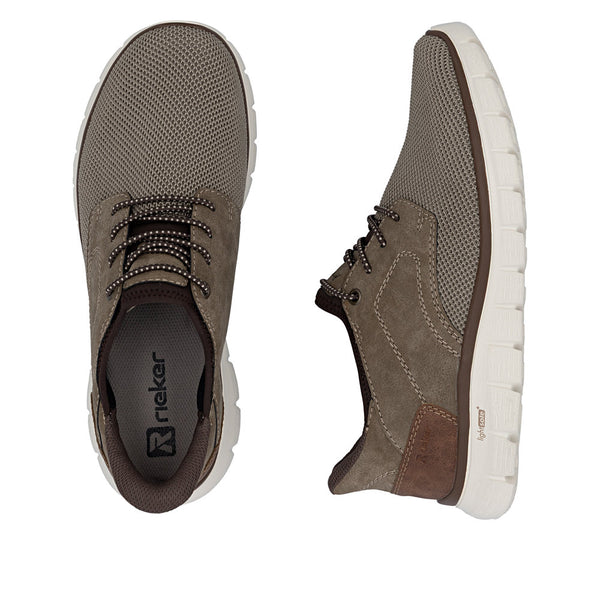 Brown sneakers with white soles on a white background