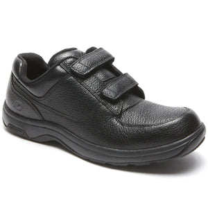 Black shoe with velcro straps on a white background