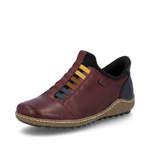Brown leather shoe with multicolor accents on a white background