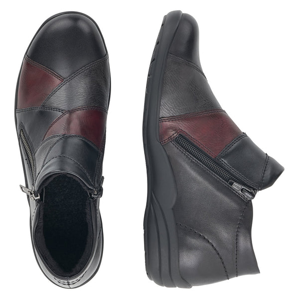 A pair of women's ankle boots shown from the top and side views on a plain white background. The boots are primarily black leather with a contrasting burgundy panel on the toe and side.