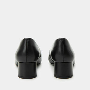 Pair of black leather shoes on a white background