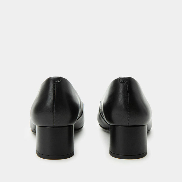 Pair of black leather shoes on a white background