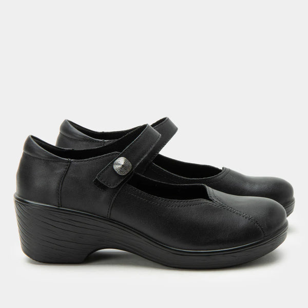 Pair of black shoes with a strap on a white background