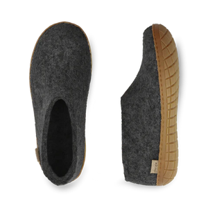 Gray felted slippers with brown soles on a white background