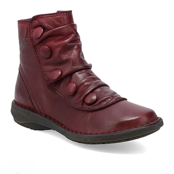 Maroon ankle boot with button details on a white background