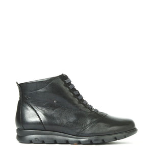 A black ankle boot with elastic bands and a zipper, featuring a leather upper and rubber outsole.