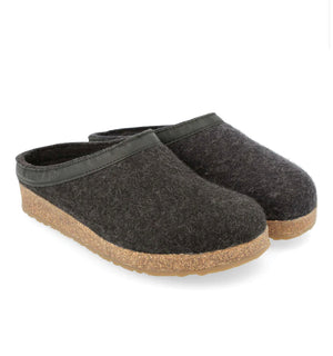 A pair of Haflinger GZL charcoal-colored slip-on clogs with a wool felt upper and a cork and latex midsole.