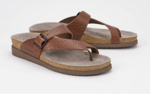 A pair of brown women's cork sandals with adjustable strap and buckle fastening.