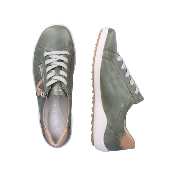 A pair of green lace-up sneakers with a thick white sole.